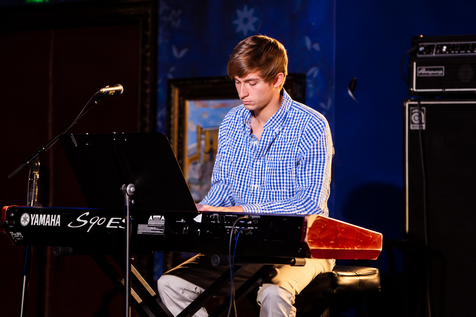 Vocalist performing beside a piano · MBMS archive